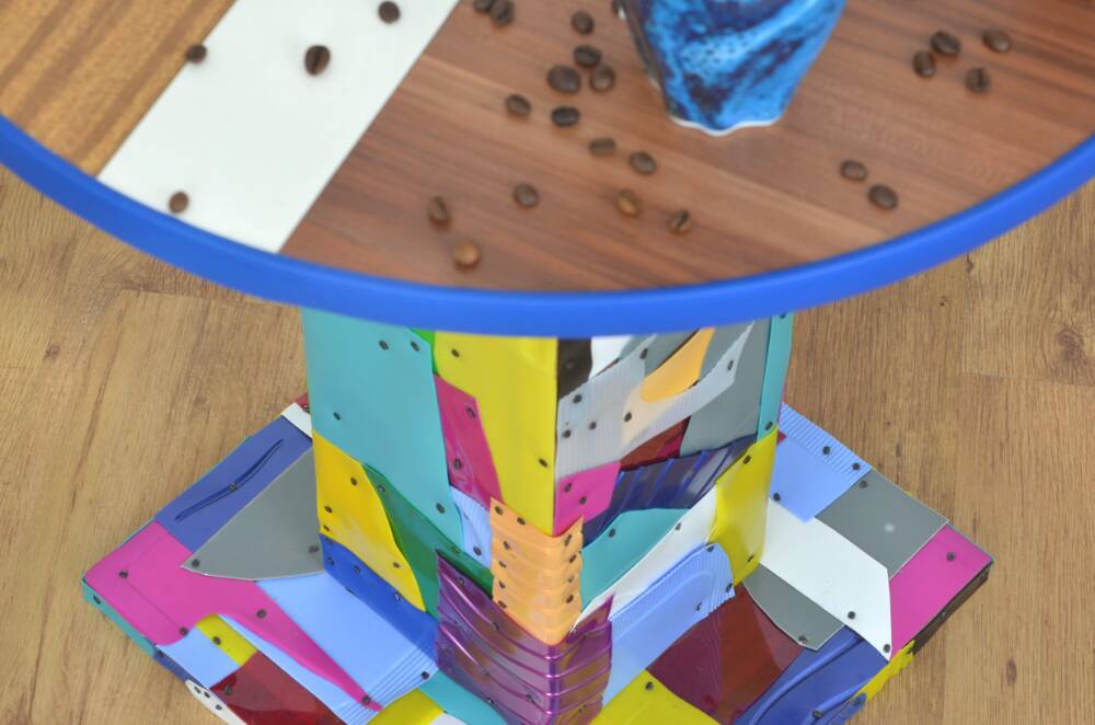 Handmade table made from recycled materials, colourful, abstract.