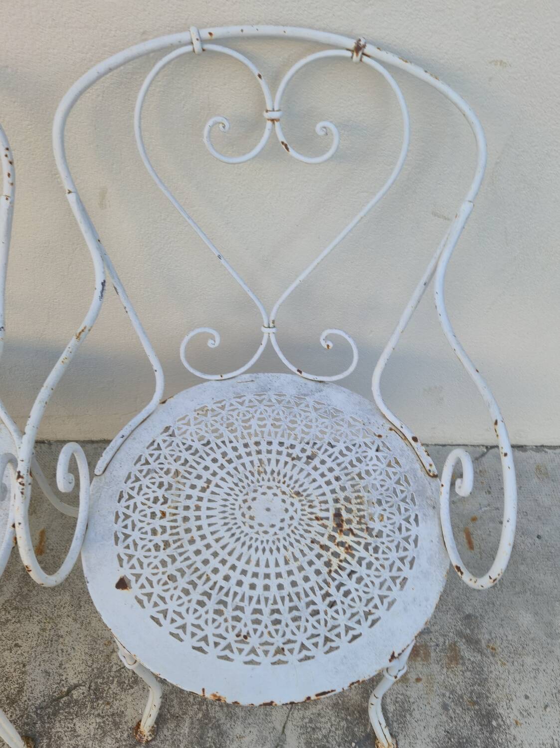 Garden furniture, two armchairs and two wrought iron chairs, period 1