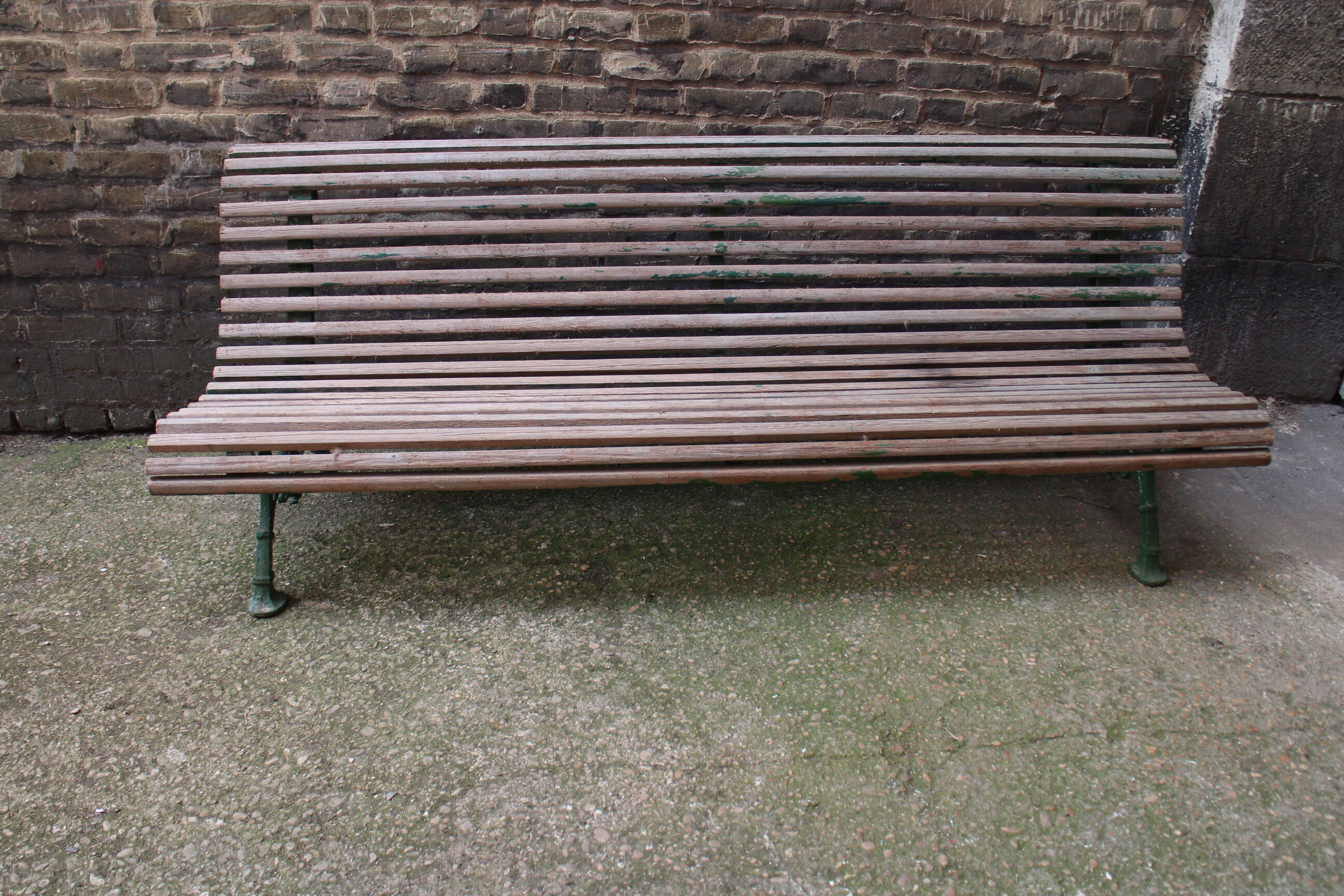 Old bench cast iron base and wooden slats