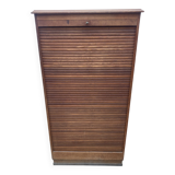 Oak two-column filing cabinet with curtains.