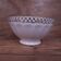 Antique white ribbed porcelain bowl with gold frieze