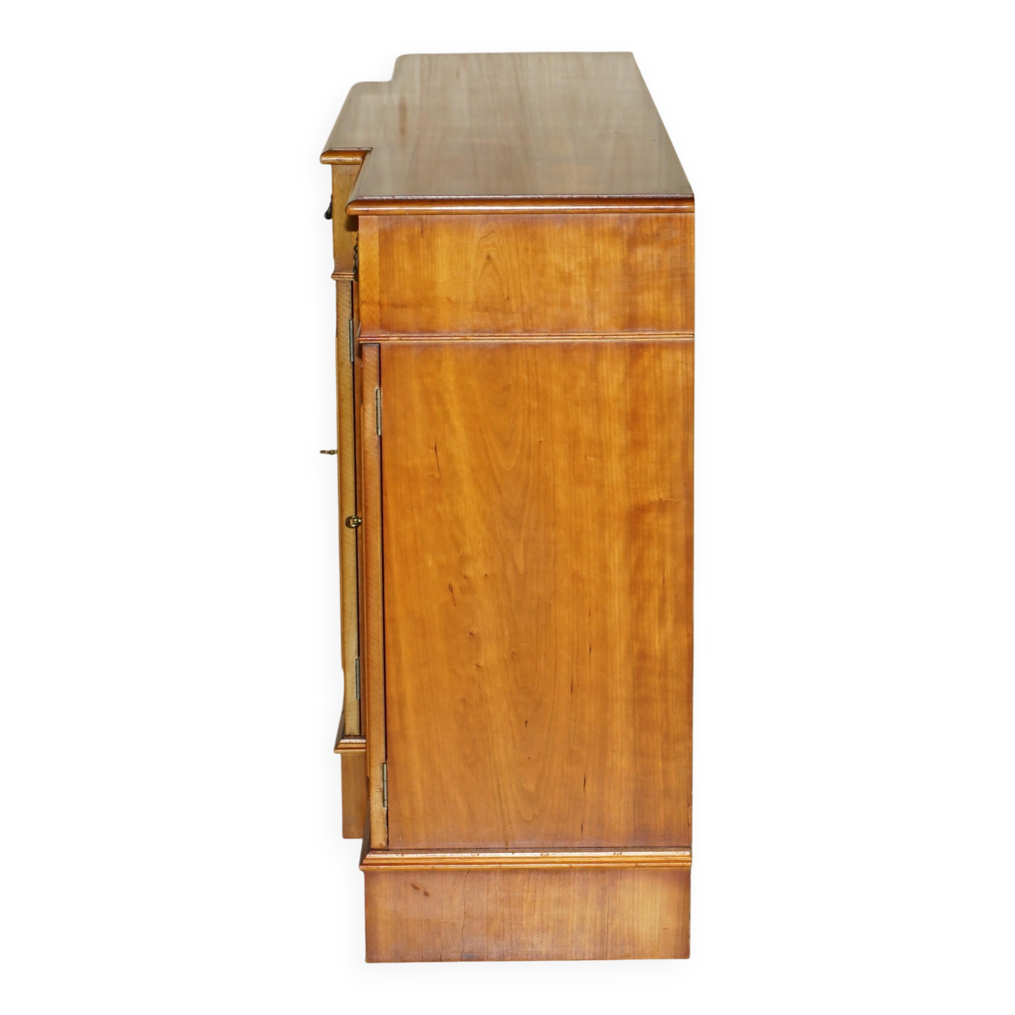 Vintage buffet made of mottled yew wood with three doors and four drawers.