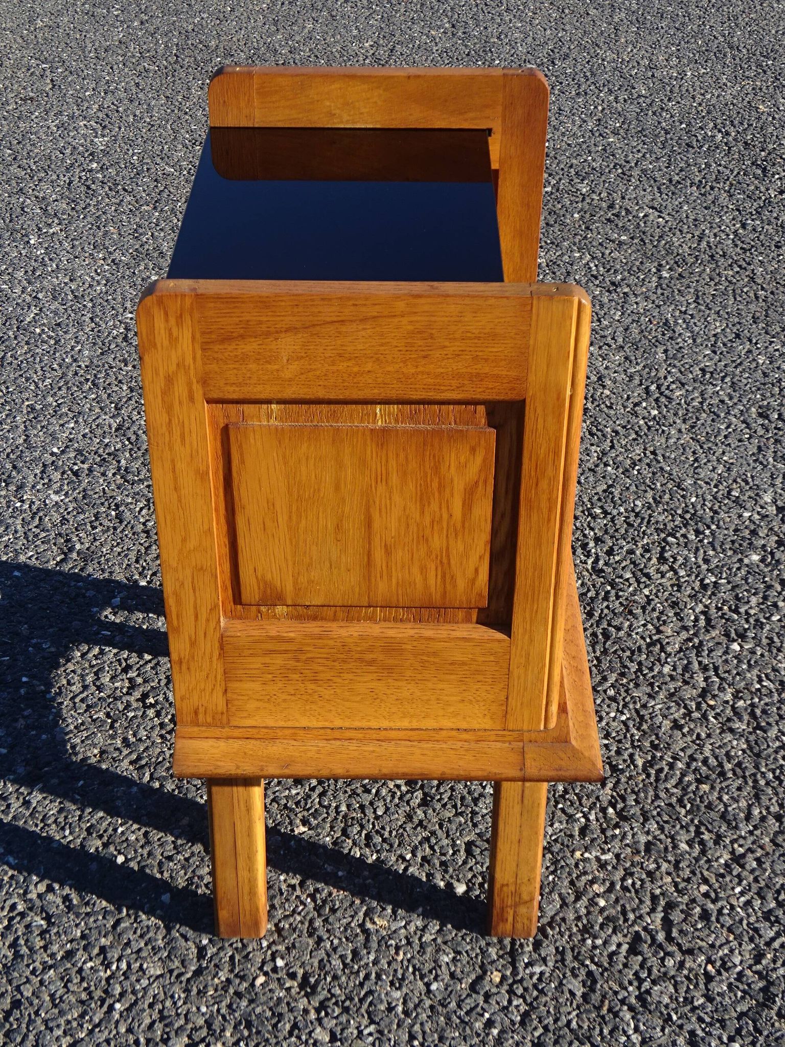 Vintage oak bedside table with tapered legs.
