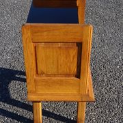 Vintage oak bedside table with tapered legs.