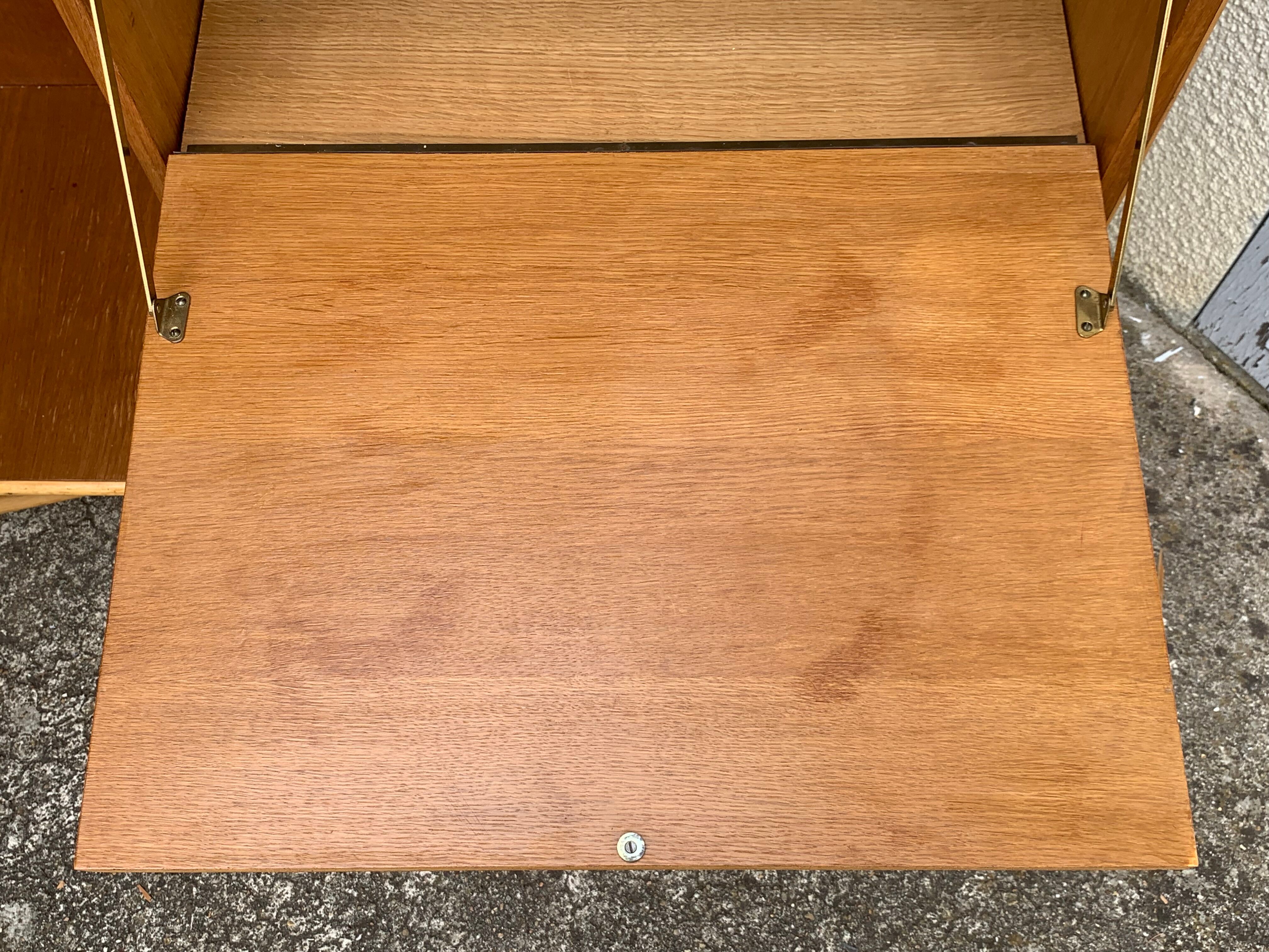 Rattan wardrobe with tapered legs from the 1960s.