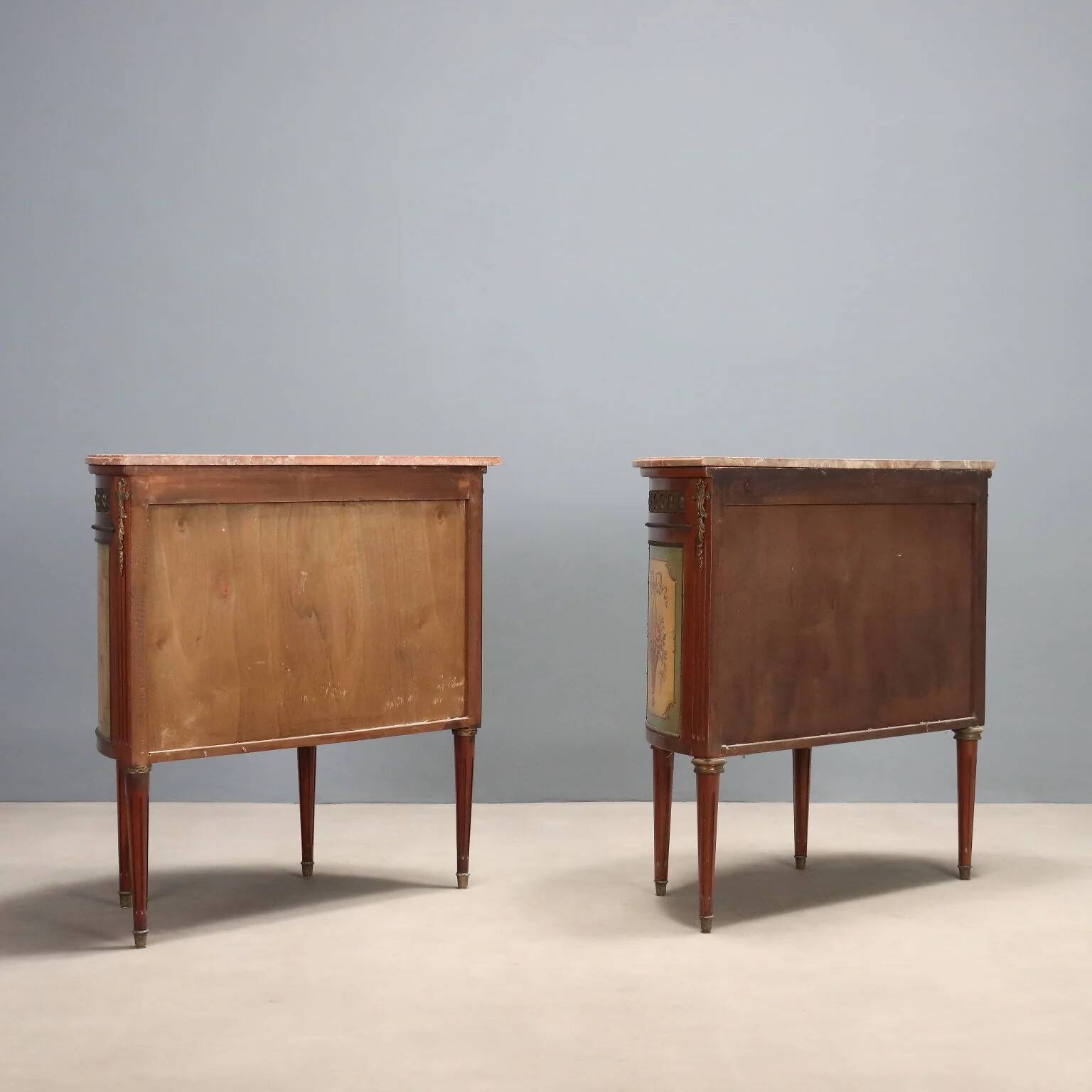 Antique demi-lune buffets in neoclassical style in mahogany from the 20th century.