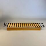 Floating wall shelf in oak veneer and black metal, 1960s.