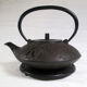 Antique cast iron teapot decorated