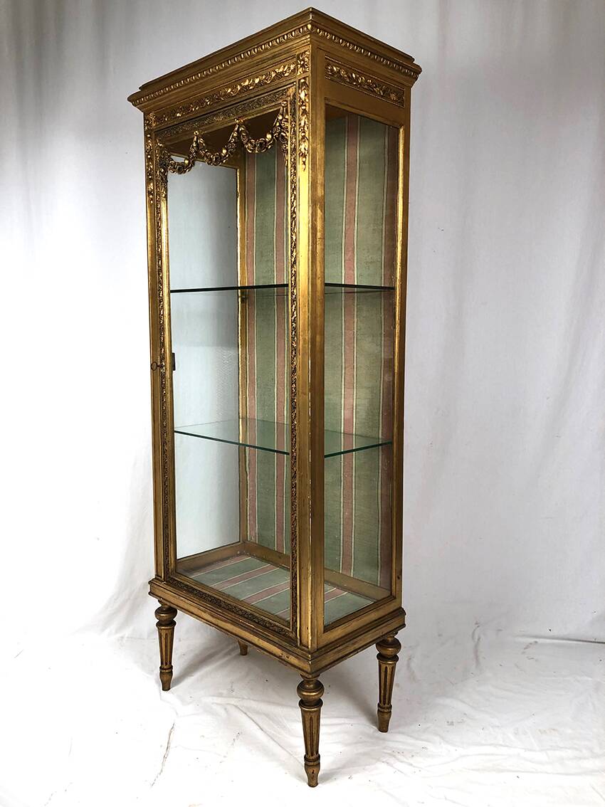 Louis XVI style showcase in wood and gilded stucco, circa 1900