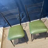 Pair of green vinyl chairs with black steel legs by Colette Gueden