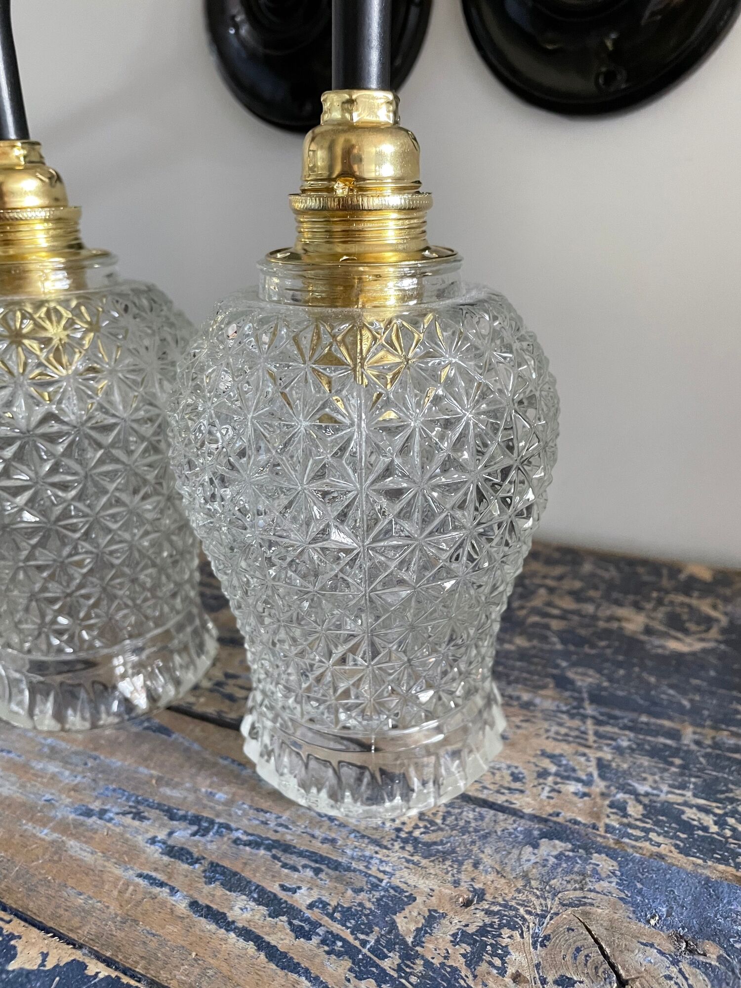Pair of vintage electrified to nine-piece chiseled glass wall lamps