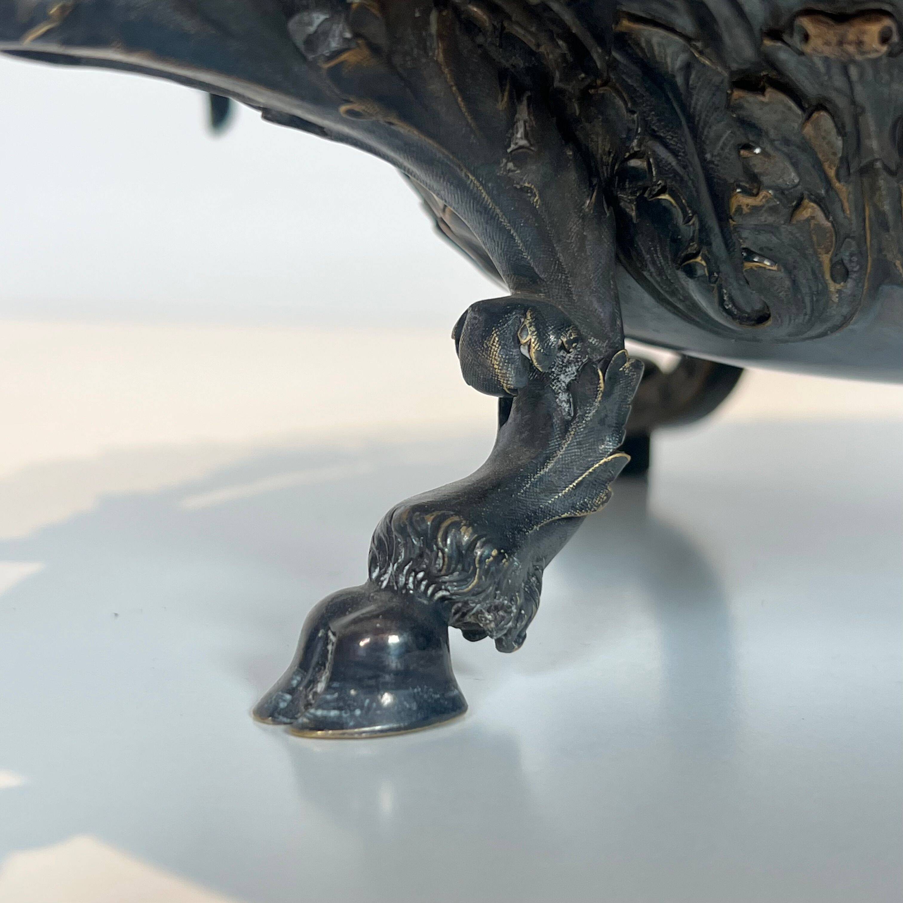 Especially a silver-plated metal table with engraving, signed.