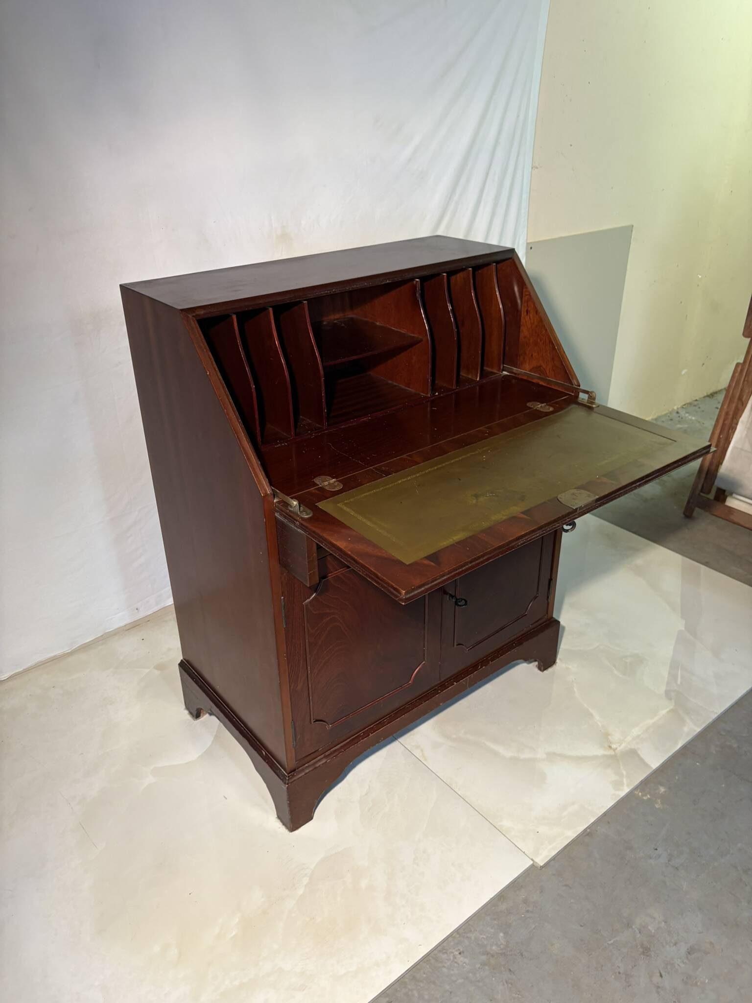 Antique mahogany secretary, upholstered flap and interior storage