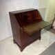 Antique mahogany secretary, upholstered flap and interior storage