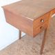 1950s oak double-sided desk with compass legs.
