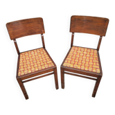 Set of 2 1950s bistro chairs in wood and rattan.