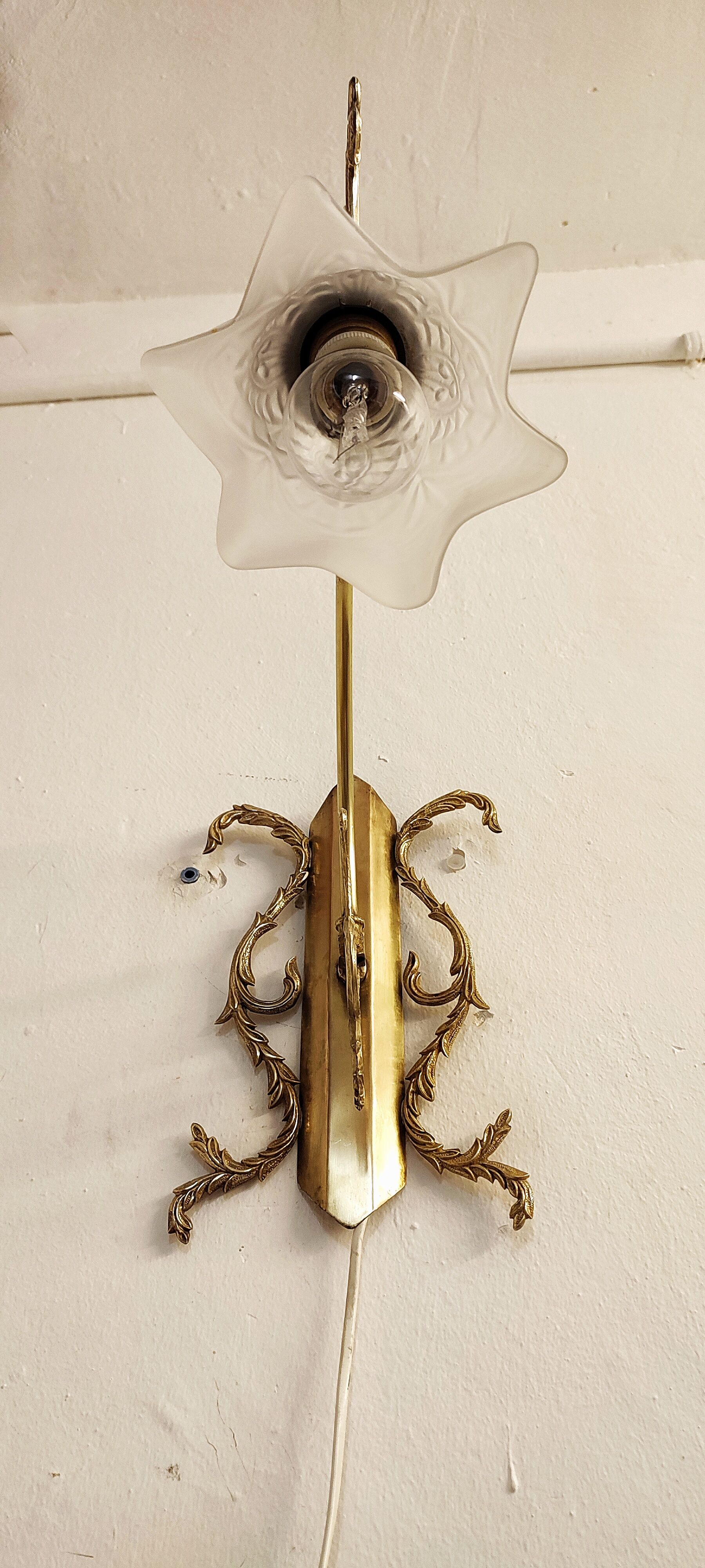 Bronze Modernist wall lamp. Spain, 1930s.