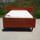 Antique teak bed with integrated bedside table