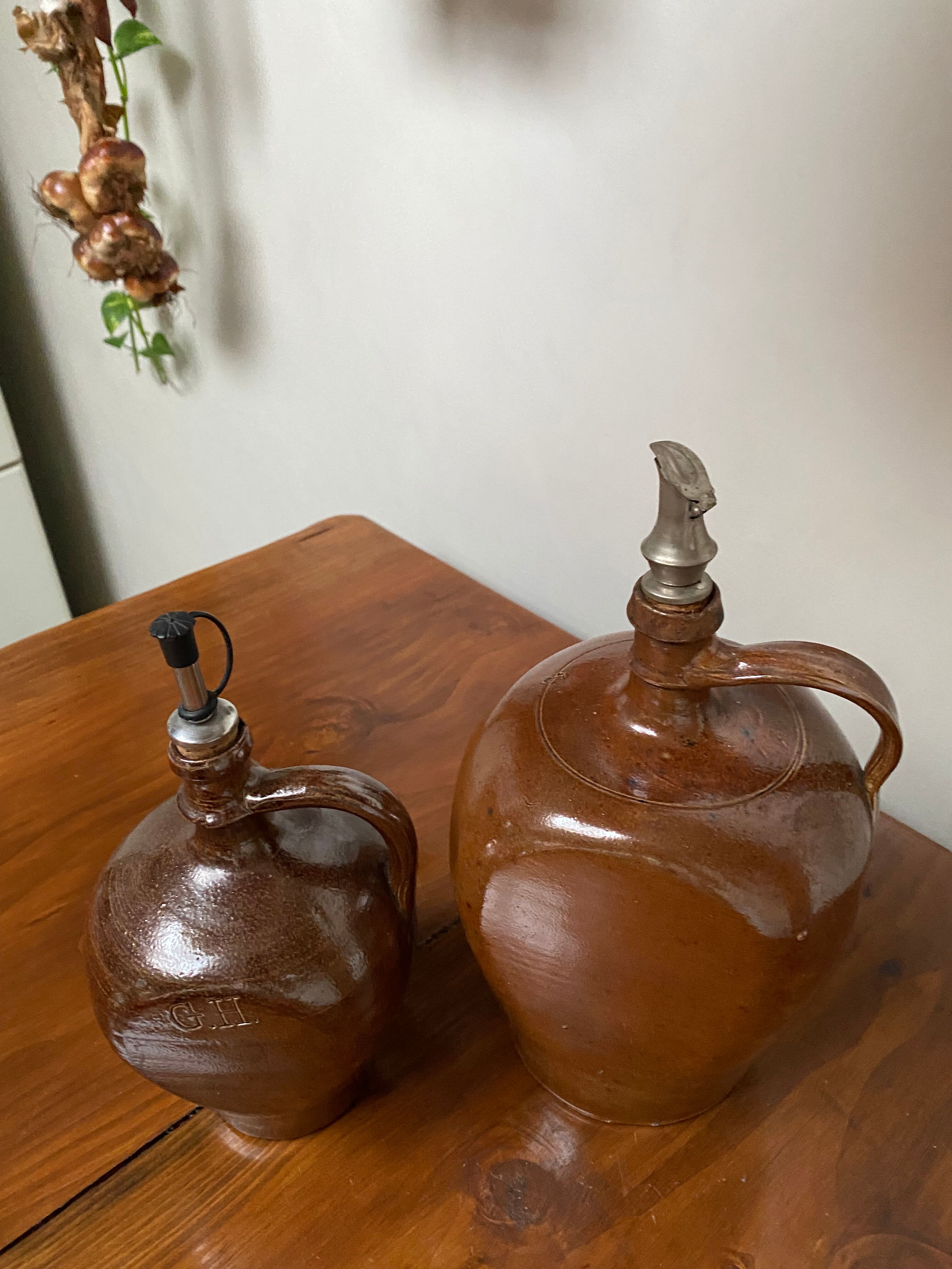 Pair of bottles in sandstone