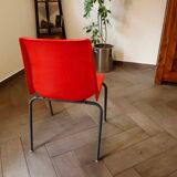 Pair of red plastic chairs with metal frame