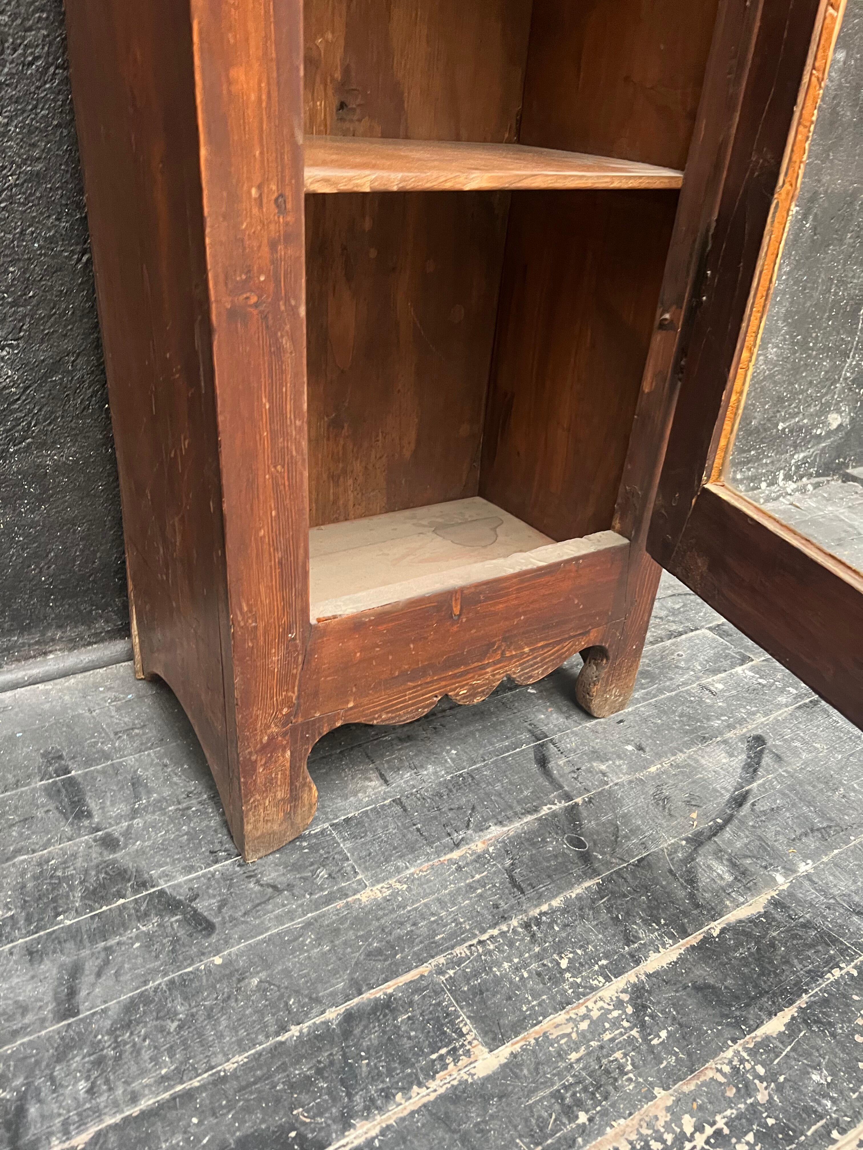 Old narrow wooden showcase.