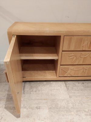 Vintage wicker sideboard with flowers