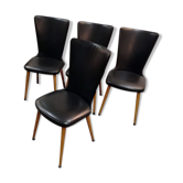 Scandinavian wood chairs and black skai