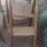 Set of five straw church chairs