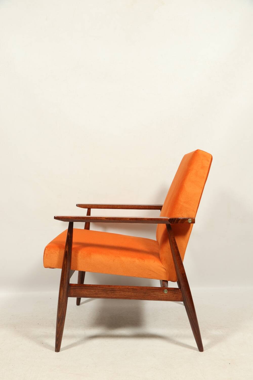 Modern armchair in orange papaya velvet with dark brown wood, 1970s Scandinavian style.
