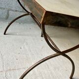 Table made of wrought iron and cement