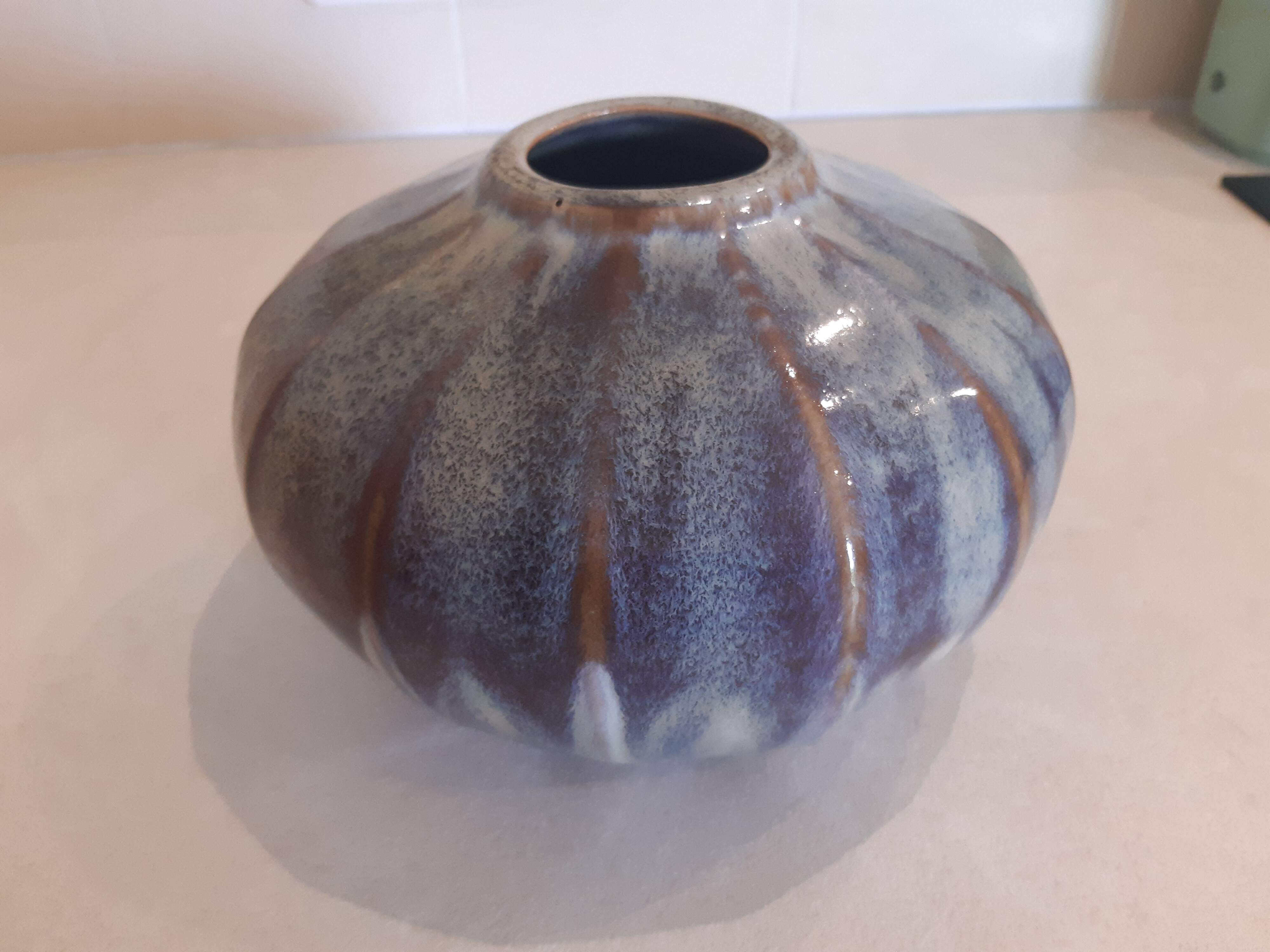 Globe vase, narrow neck, wide body.
