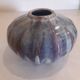 Globe vase, narrow neck, wide body.