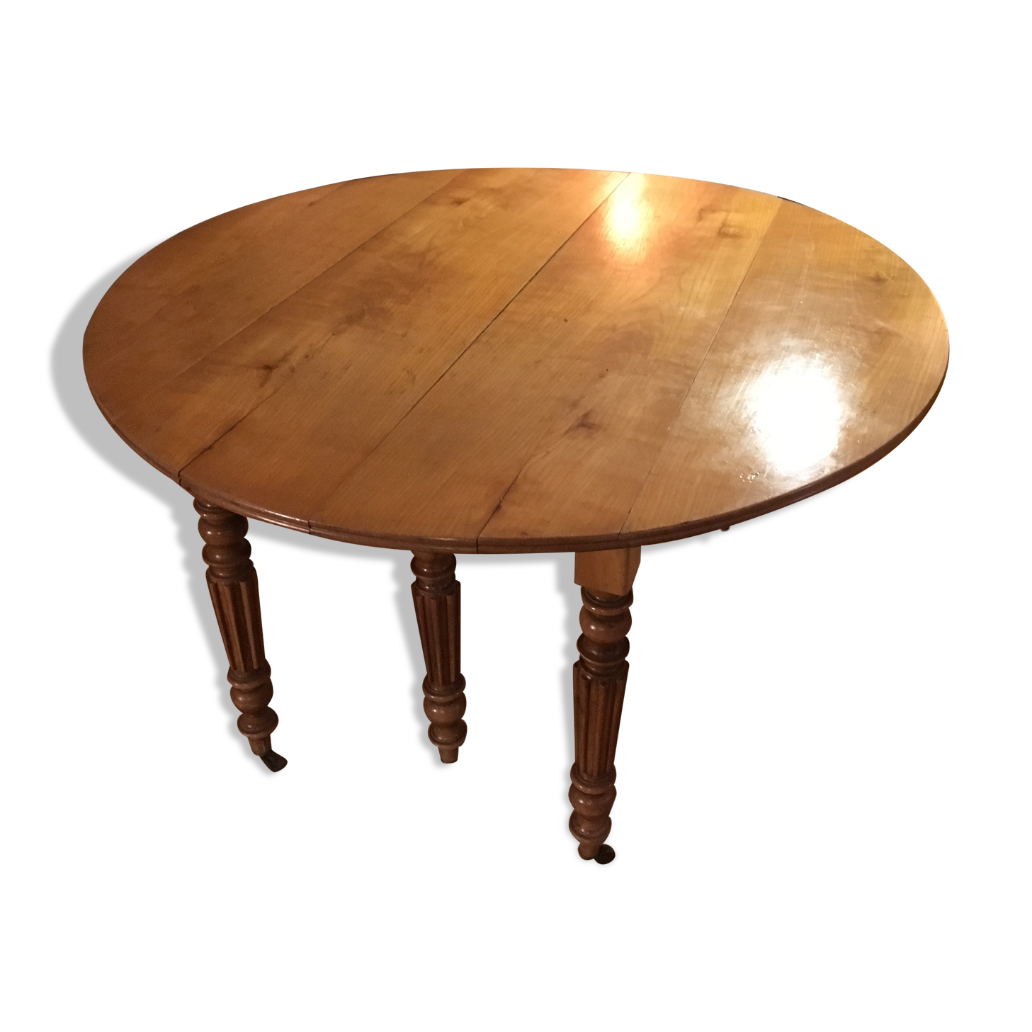 Table ronde style empire en bois merisier massif 6 pieds sur roulettes