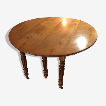 Table ronde style empire en bois merisier massif 6 pieds sur roulettes