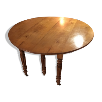 Table ronde style empire en bois merisier massif 6 pieds sur roulettes