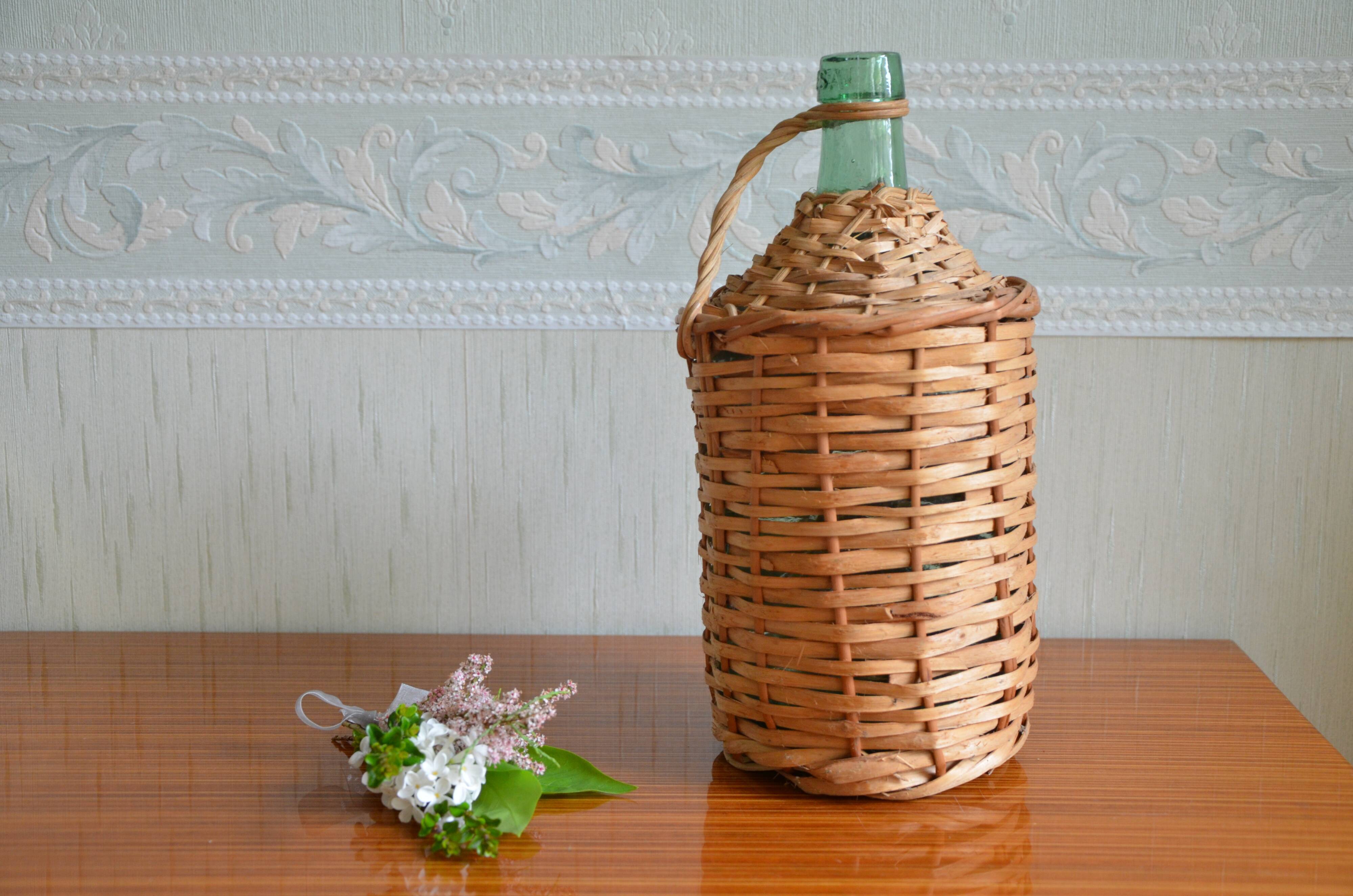 Viresa glass bottle and woven rattan