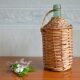 Viresa glass bottle and woven rattan