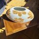 Large vase with golden flowers in ceramic
