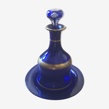 Night carafe and its blue glass saucer