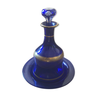 Night carafe and its blue glass saucer