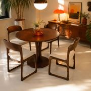 Four vintage Baumann sled chairs from the 1960s 1970s.