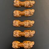10 ceramic knife holders in the shape of a recumbent poodle