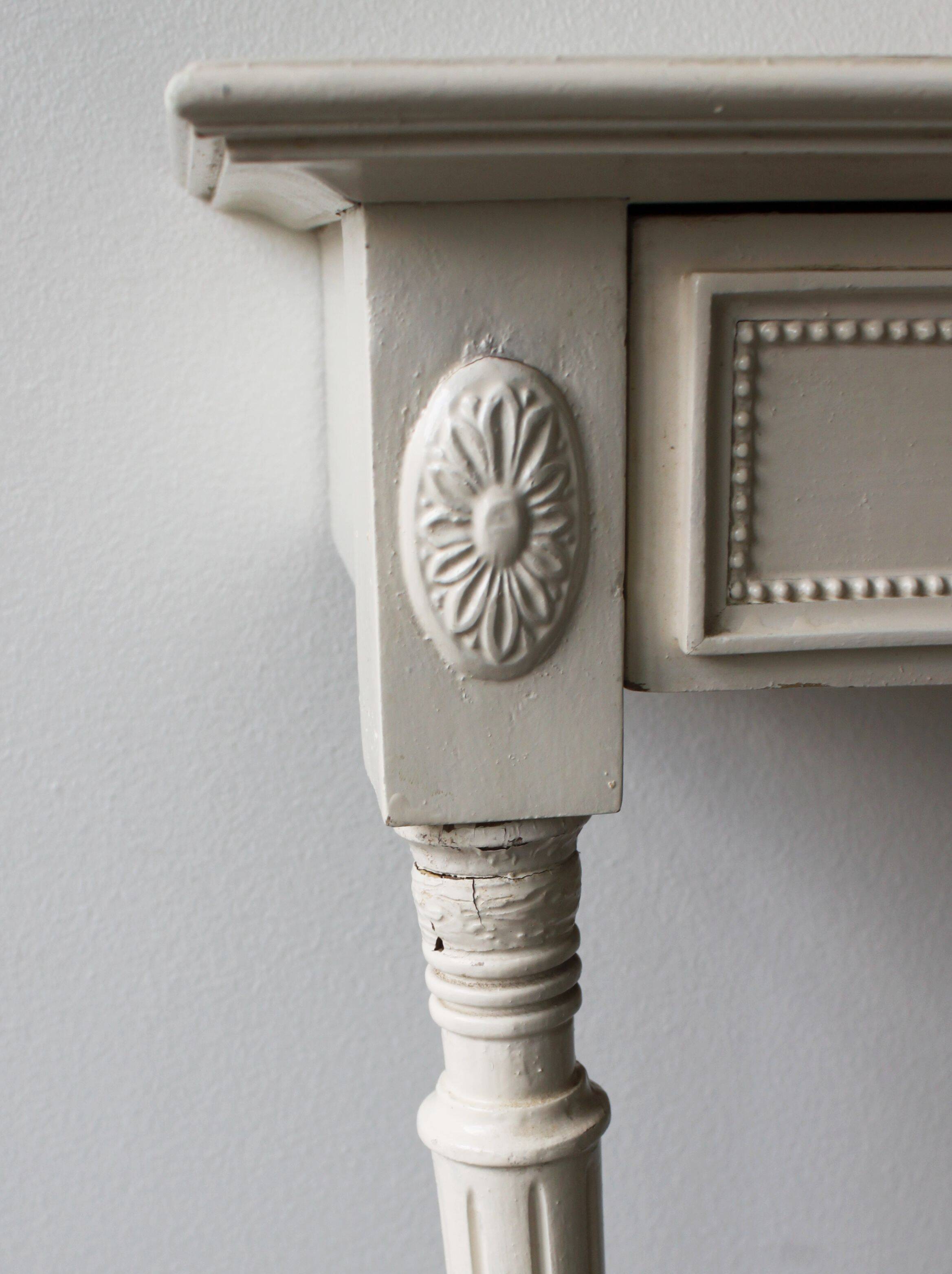 Two-legged wall console in Louis XVI style, painted wood.