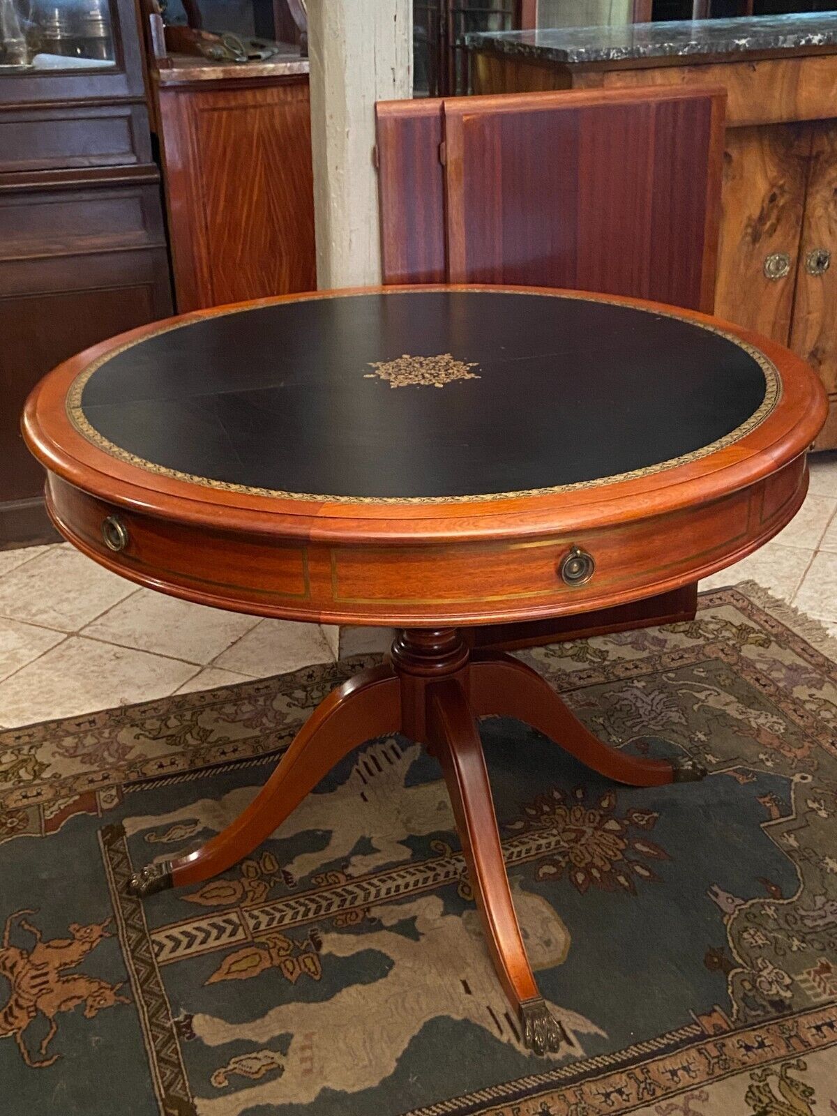 Circular table in solid mahogany and black leather claw base Restoration