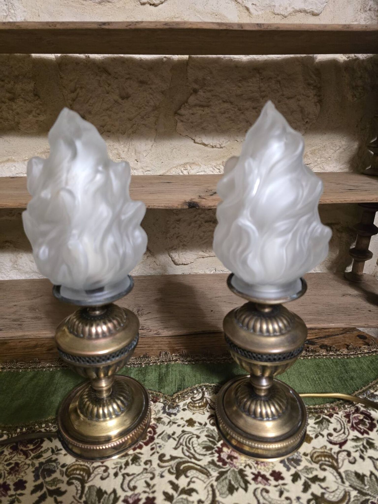 Small globe lamp with flame and brass base for oil.