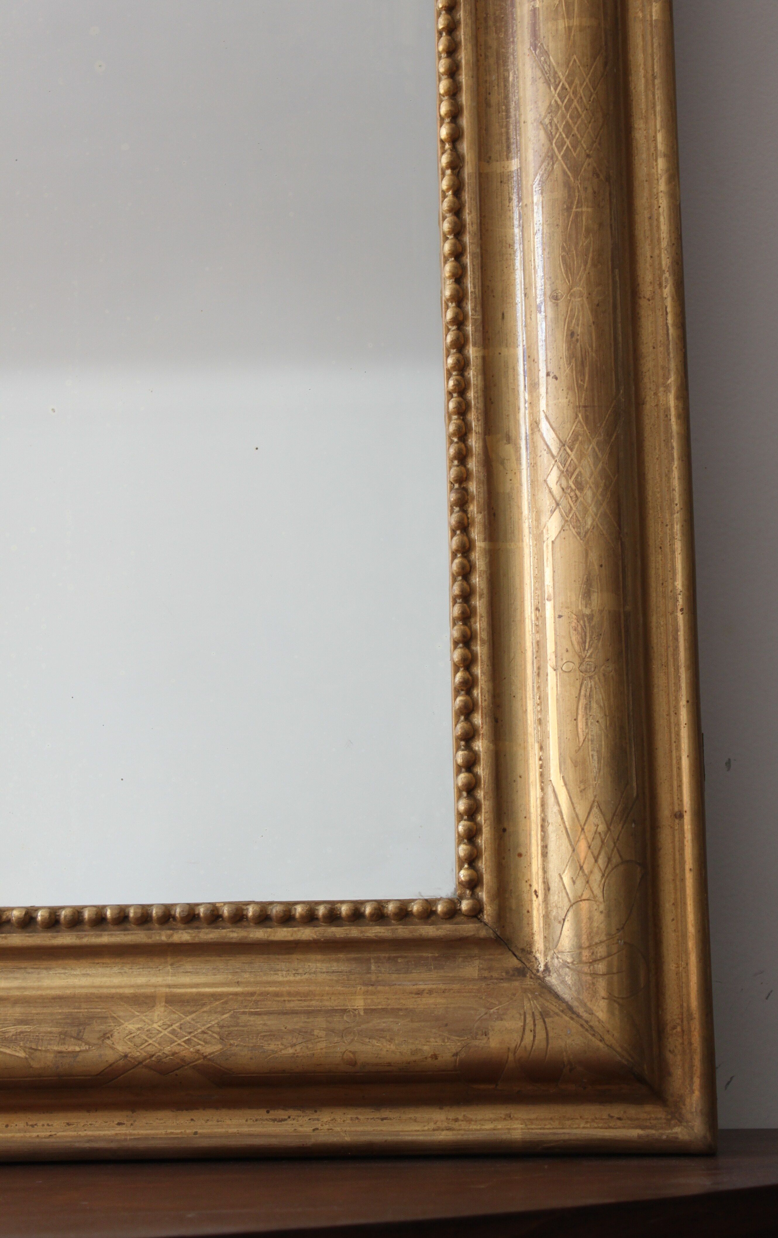 Old gilded mirror with A pediment