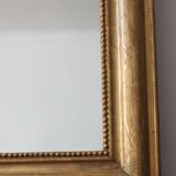 Old gilded mirror with A pediment