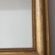 Old gilded mirror with A pediment