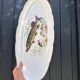 Large fish platter and its vintage porcelain sauce boat, decorated with pike.