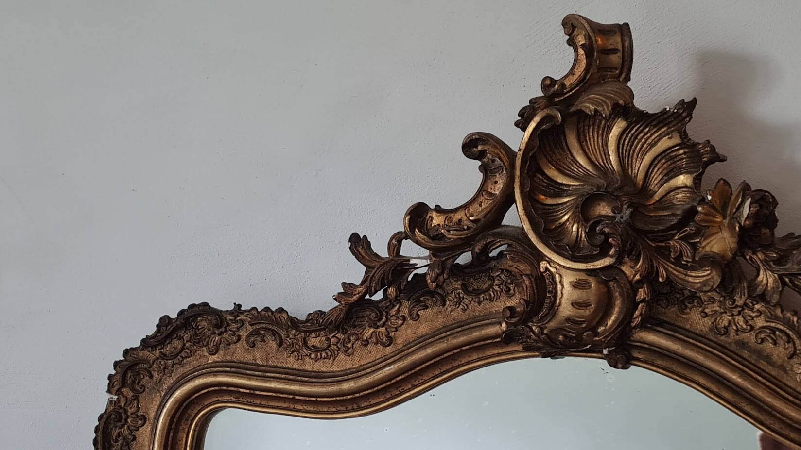 Antique Louis Philippe mirror with a pediment.